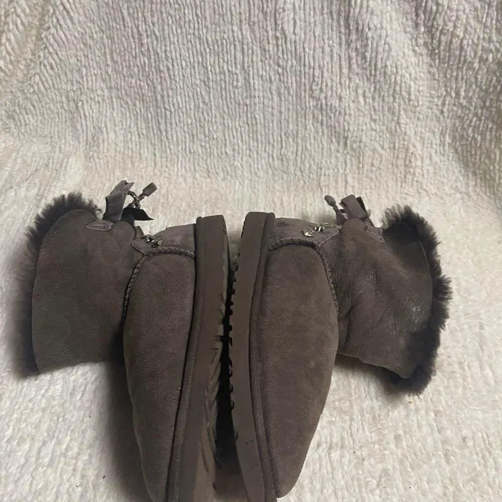 UGG Chocolate Shearling Boots with crystal and studs and bow accents SZ7